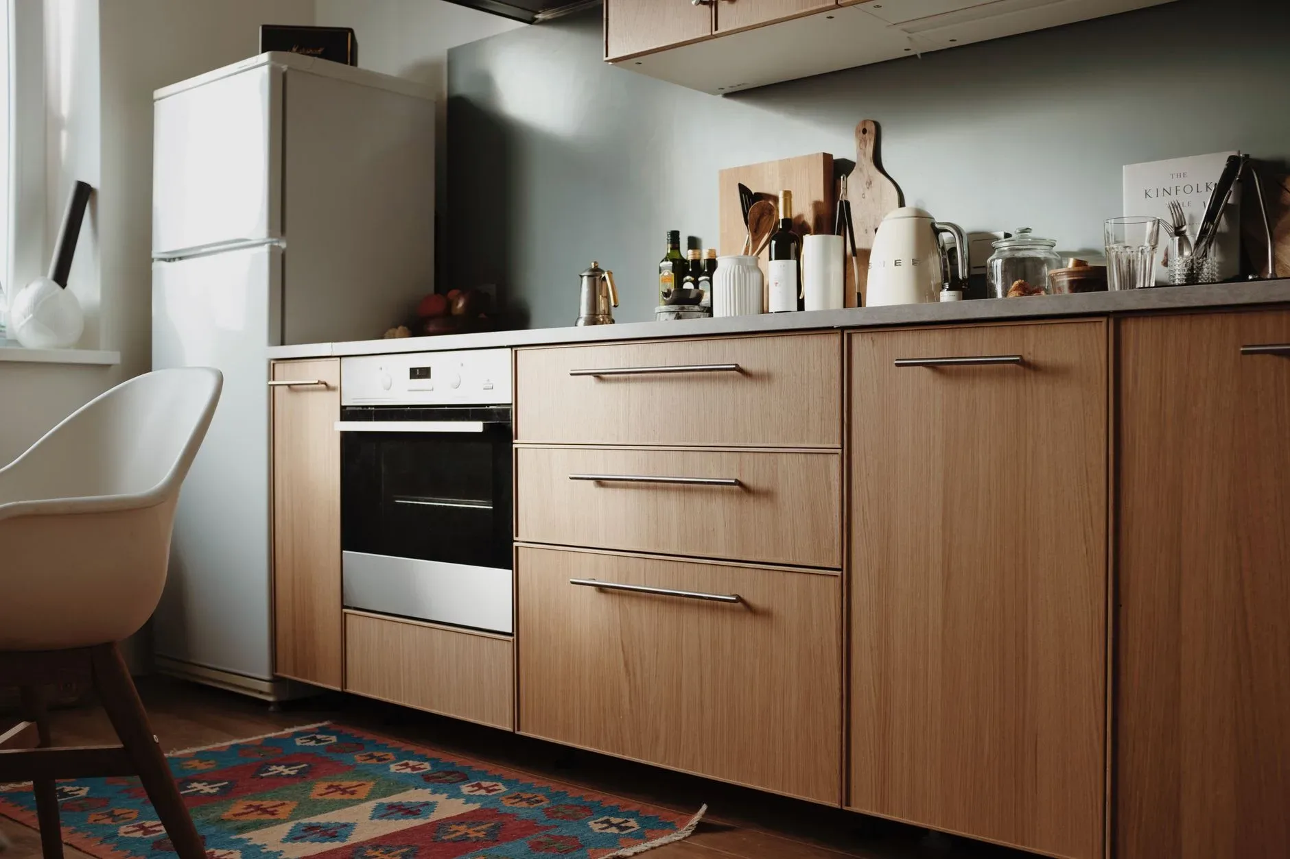 15 Wood Kitchen Ideas That Bring Warmth and Character to Any Home Beautiful modern kitchen featuring sleek wooden cabinets and appliances.