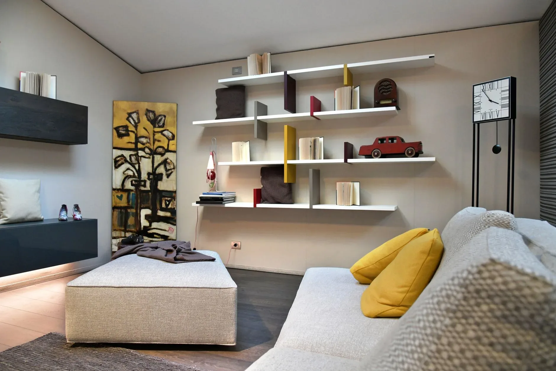 12 Wall Decor Ideas That Turn Every Blank Wall Into Something Beautiful Chic and cozy Italian living room featuring modern shelving and artistic elements.