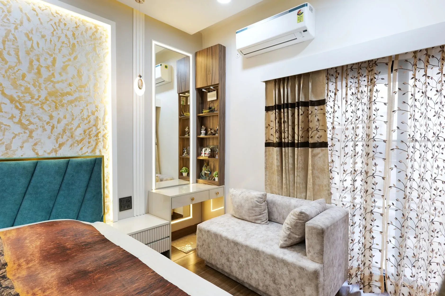 Contemporary bedroom with cozy sofa, chic curtains, and elegant decor.