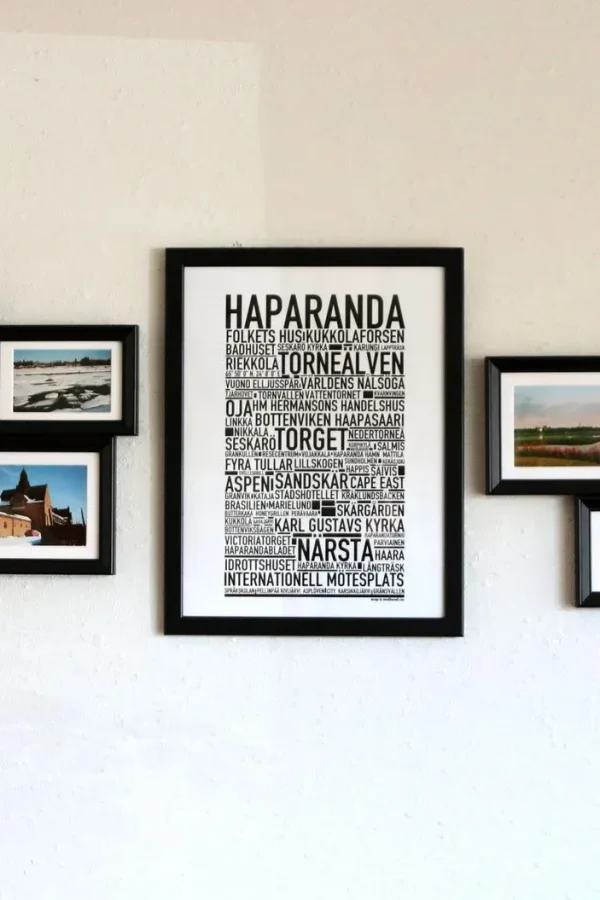 Elegant wall art with black frames showcasing Haparanda themes and landscape photos.