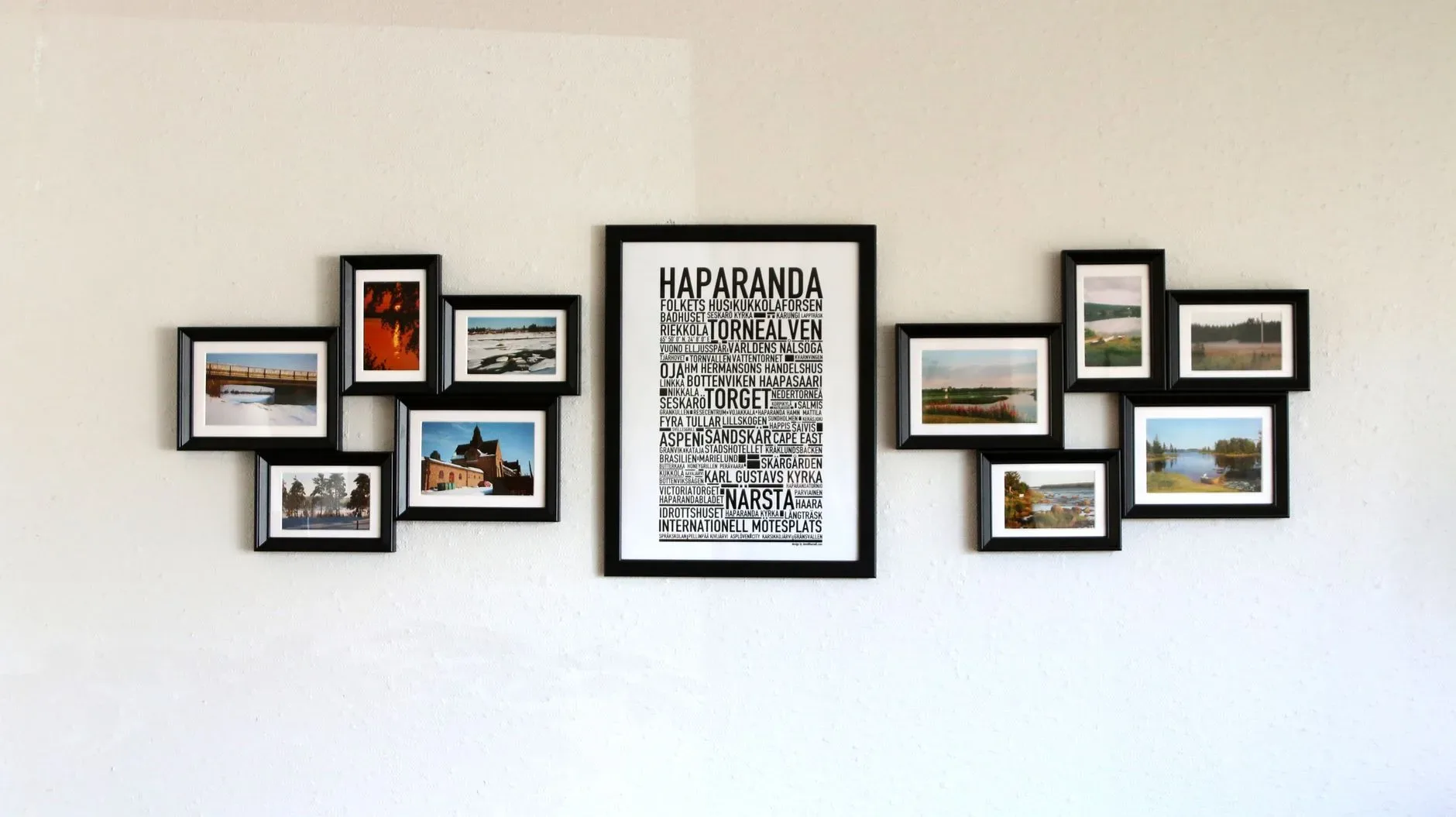 12 Wall Decor Ideas That Turn Every Blank Wall Into Something Beautiful Elegant wall art with black frames showcasing Haparanda themes and landscape photos.