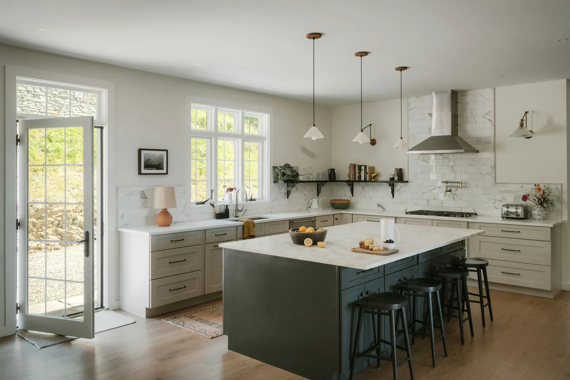 12 Green Kitchen Ideas That Feel Fresh and Modern Modern kitchen with island and stainless steel appliances.