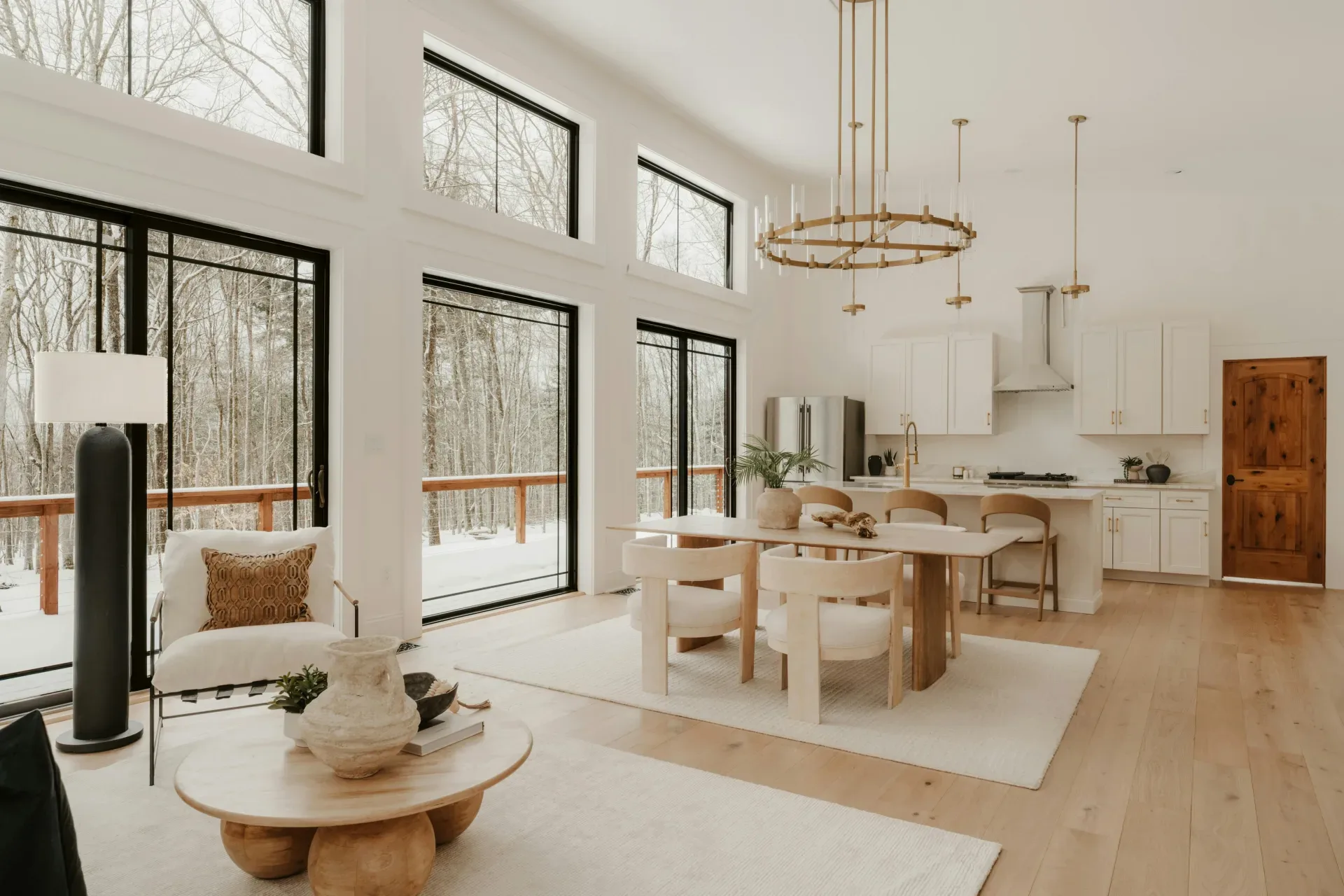 20 Cozy Kitchen Ideas That Make Cooking Feel Like the Best Part of Your Day Modern living room with large windows overlooking winter forest