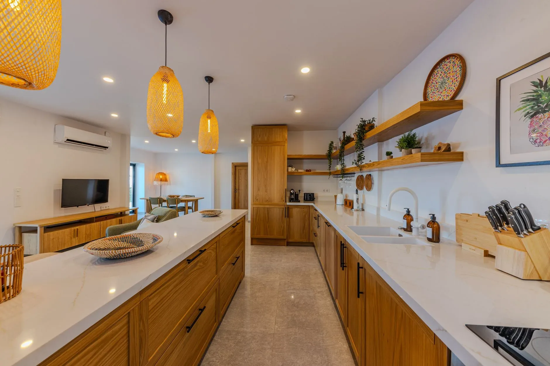 18 Cozy Kitchen Decor Ideas for a Warm Home Spacious contemporary kitchen interior with wooden cabinets, ambient lighting, and modern appliances.