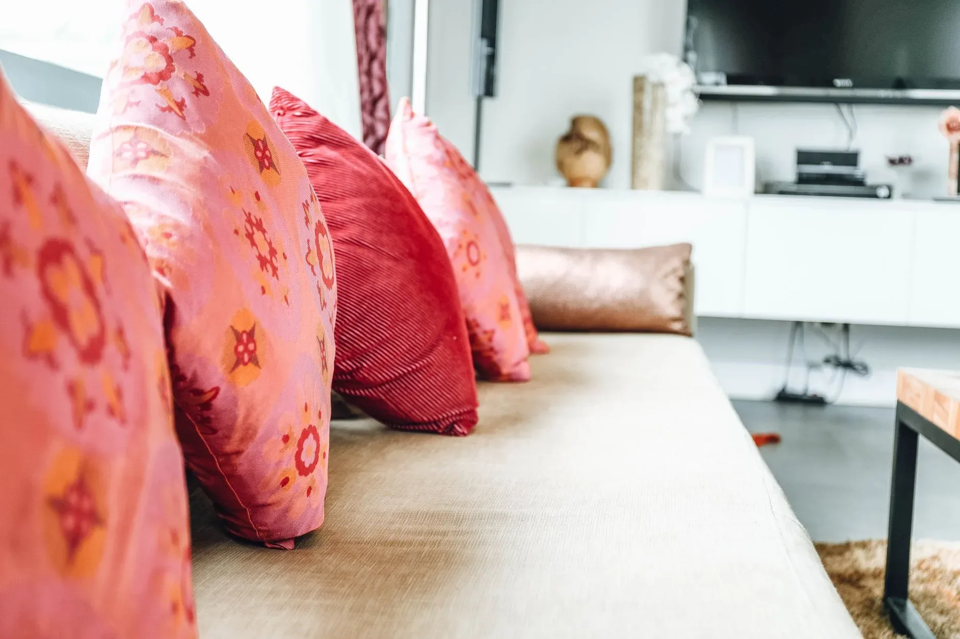15 High-End Living Room Ideas for Small Spaces Stylish living room interior with colorful throw pillows and modern furniture.