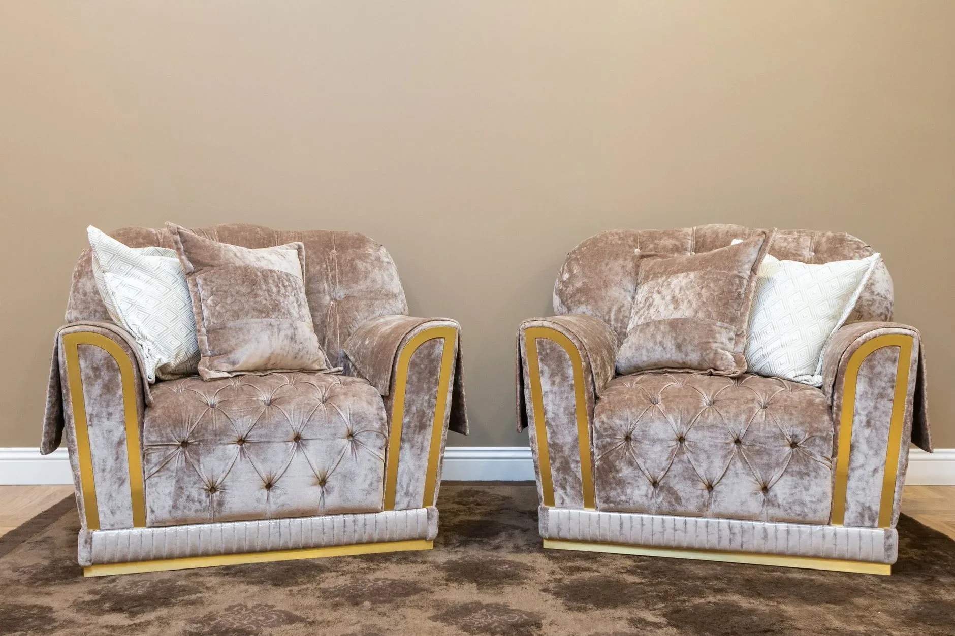 15 High-End Living Room Ideas for Small Spaces Two plush velvet armchairs in a cozy modern living room setting.