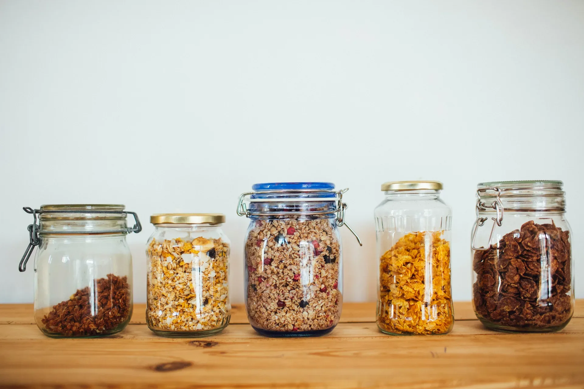20 Cozy Kitchen Ideas That Make Cooking Feel Like the Best Part of Your Day two clear glass jars with brown and black beads